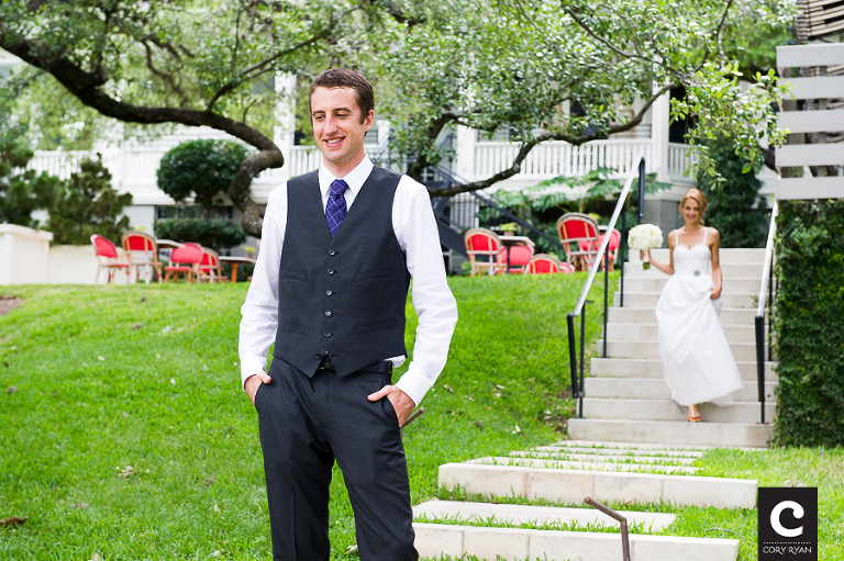 bride walking down stairs to the groom