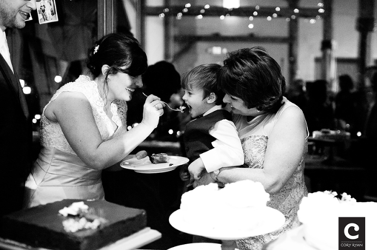 ring bearer eating wedding cake