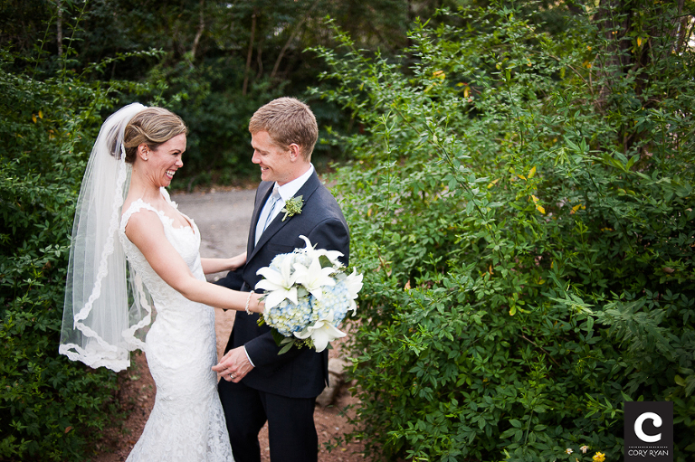 bride and groom smile and laugh