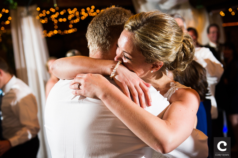 bride and groom embrace for last dance