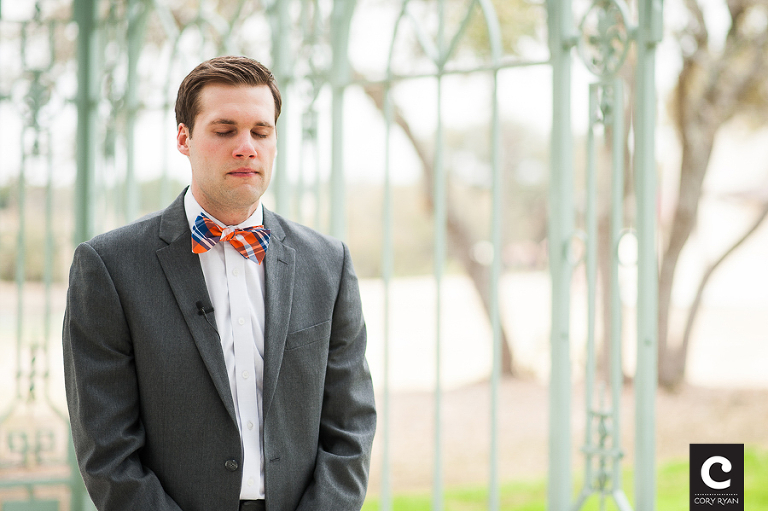 emotional groom waits for his bride
