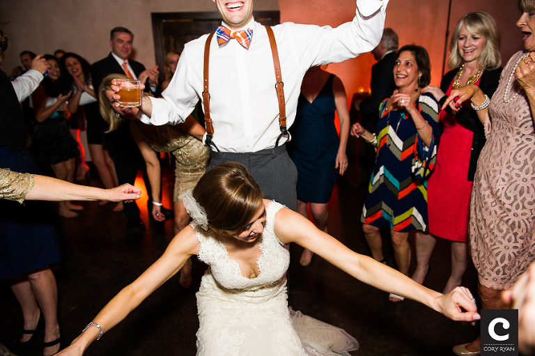 groom with bow tie dancing