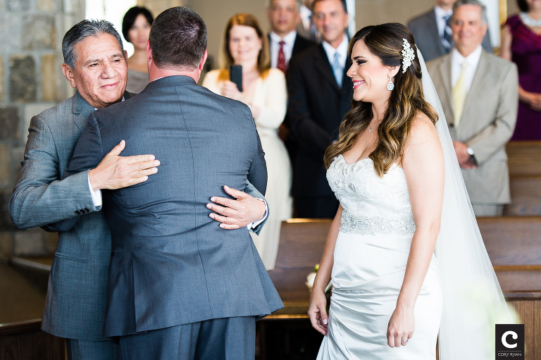 dad hugging groom