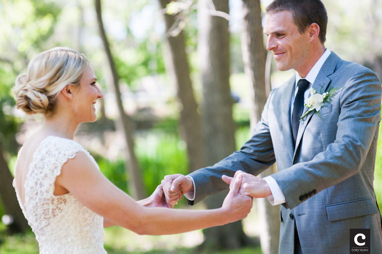 bride and groom holding hands