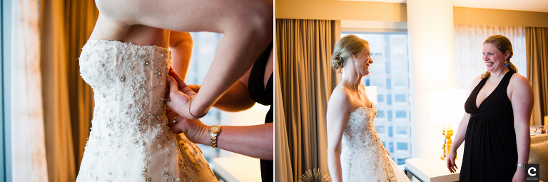 bride putting on wedding dress