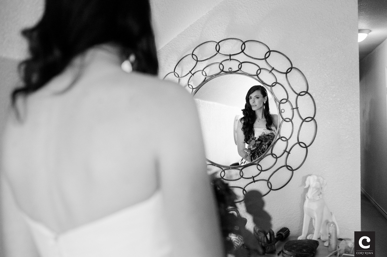 bride looking at herself in the mirror