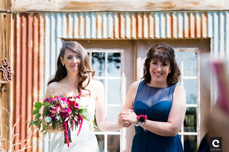 mom walking bride down the aisle