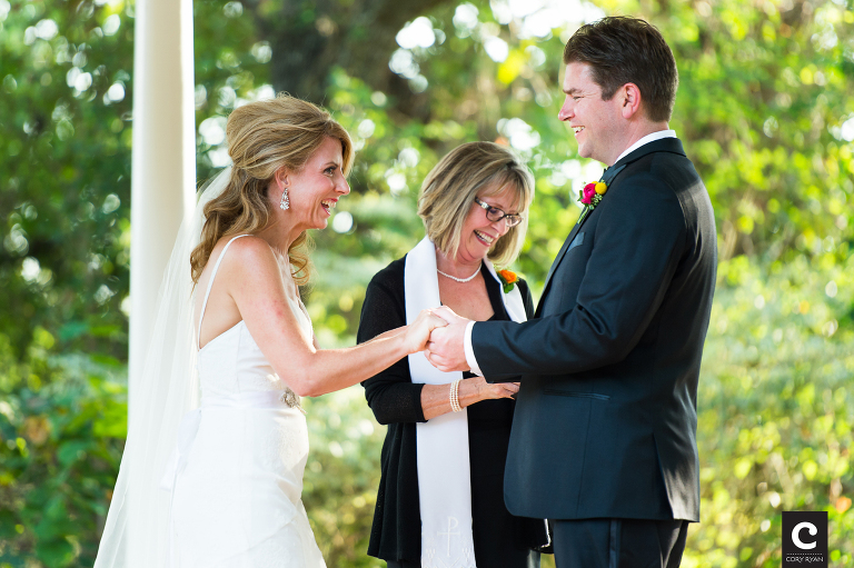 bride and groom laughing at ring exchange