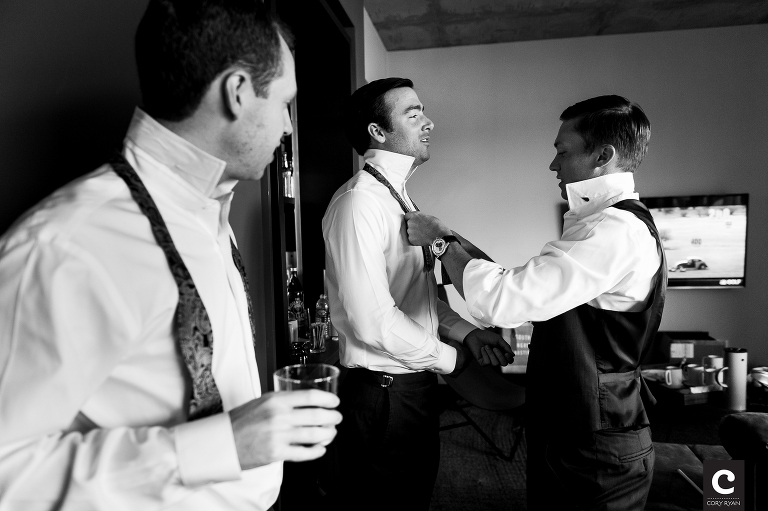 groom and groomsmen getting dressed
